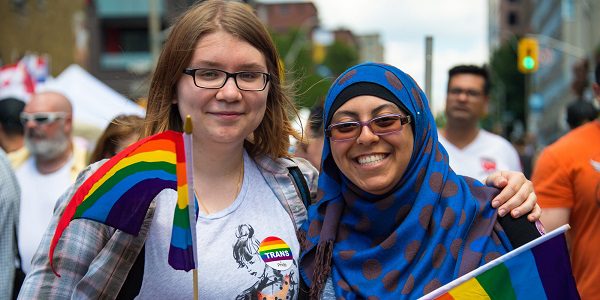 TORONTO, ONTARIO, CANADA - 2016/07/03: Muslim woman and Canadian woman marching in the 36th Pride Parade celebration. (Photo by Roberto Machado Noa via Getty Images)