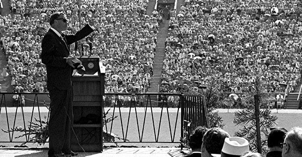 Evangelist Billy Graham preaches one Sunday to more than 40,000 worshipers at the Los Angeles Memorial Coliseum. (Edited version of a UCLA image.