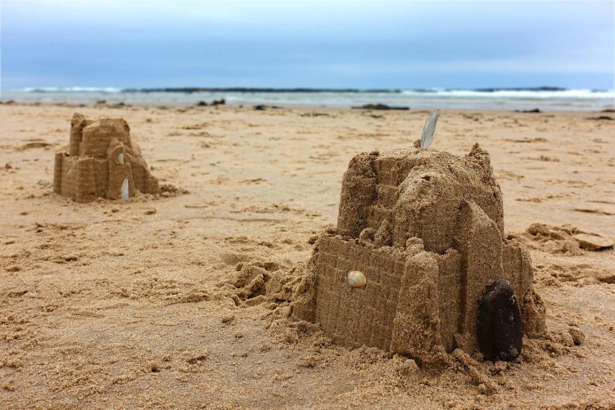Sandcastles at the seaside to evoke C.S. Lewis' classic quote.