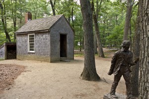 "Replica of Thoreau's cabin near Walden Pond and his statue" by RhythmicQuietude at en.wikipedia. Licensed under CC BY-SA 3.0 via Commons - https://commons.wikimedia.org/wiki/File:Replica_of_Thoreau%27s_cabin_near_Walden_Pond_and_his_statue.jpg#/media/File:Replica_of_Thoreau%27s_cabin_near_Walden_Pond_and_his_statue.jpg