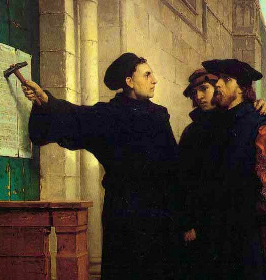 Martin Luther tacks his 95 Theses to the door at Wittenburg 