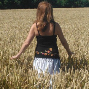 Priestess in Lammas field; photo by Suzanne Corbie