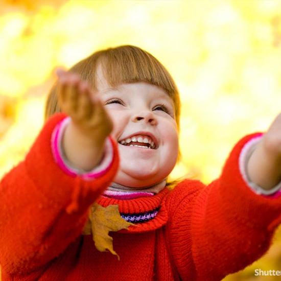 child-fall-throwing-leaves-smille-laughing