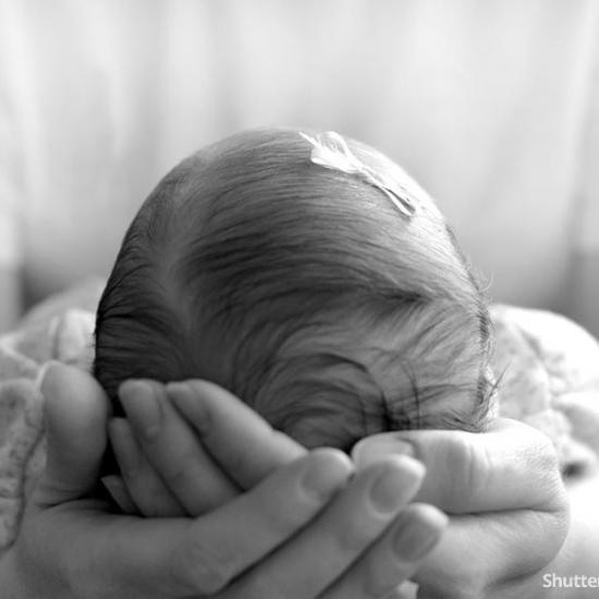 infant-girl-hands-mother