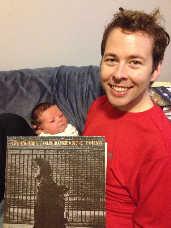 The proud papa, Steve, with son Caleb and first-listen Neil Young.
