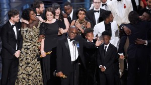 Barry Jenkins, foreground center, and the cast accept the award for best picture for "Moonlight" at the Oscars on Sunday, Feb. 26, 2017, at the Dolby Theatre in Los Angeles. (Photo by Chris Pizzello/Invision/AP)