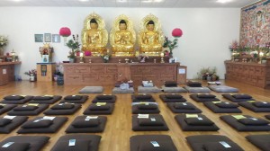 three bronze statues of the buddha