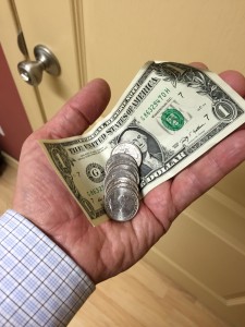 hand with cash and coins