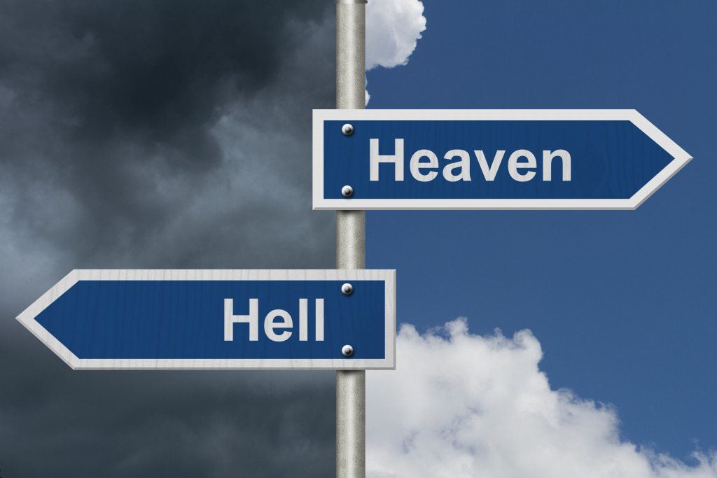 Heaven or Hell, Two Blue Road Sign with text Heaven and Hell with bright and stormy sky background