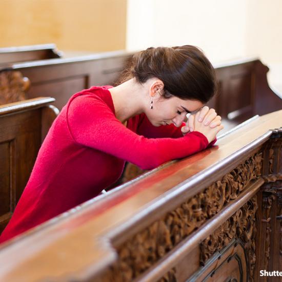 people-woman-praying-at-church