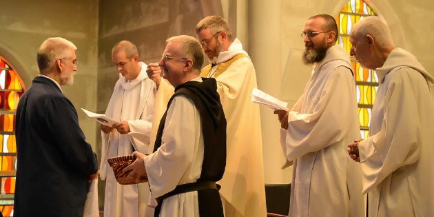Receiving a medal from the monks after making my Lay Cistercian Life Promises, May 2012.