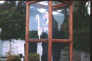 Statue of St. Brigid at the Holy Well dedicated to her in Liscannor. She's kept in glass to protect her from the elements. (Photo by Carl McColman)