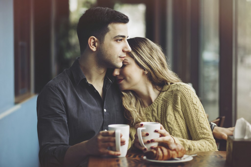 Couple in love drinking coffee in coffee shop