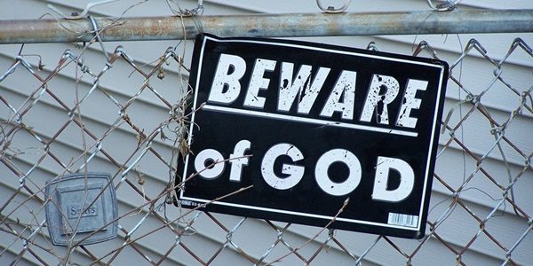 Photo: Flickr, James Quinn, "Beware of God," Creative Commons License, some changes made. 