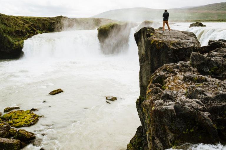 person-stream-cliff-river