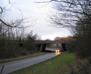 Car driving under bridge