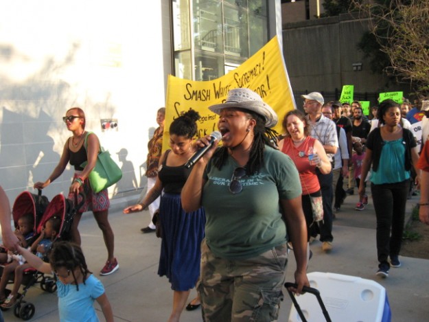 Marching and singing. Mary Hooks of Southerners On New Ground holding the microphone.  I am behind her.