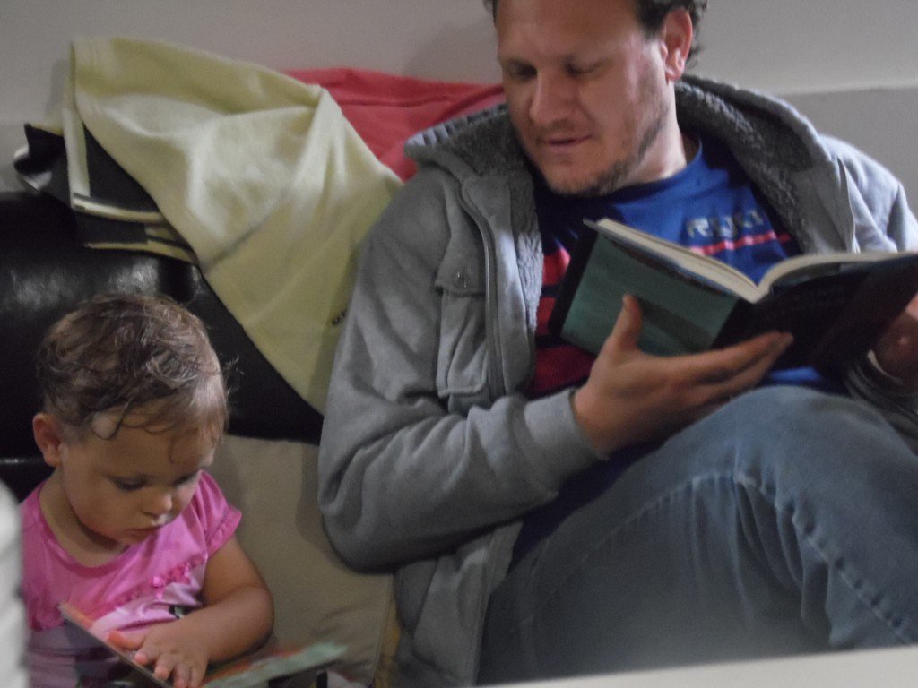 My daughter Hannah and I reading. I'm going through Bridge to Wonder, which I will review for Syndicate Theology. 