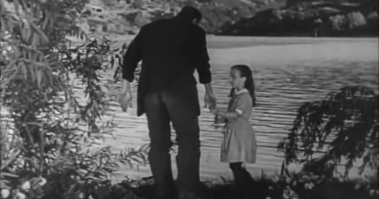 Frankenstein talking nicely with a little girl ... for a while