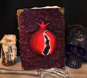 Spectacular handmade leather Persephone pomegranate journal by Lily Lion Labyrinth, available at her Etsy shop, which you can find by clicking the picture. Copyright (c) 2014 by Lily Lion Labyrinth. Used by permission.