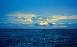 Image Description: ocean with clouds above it.