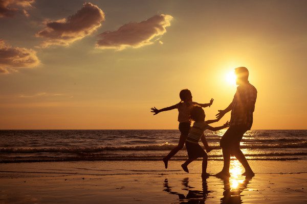 familiy on beach sunset