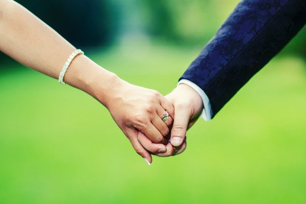 wedding couple holding hands