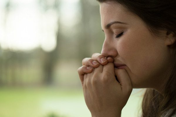 sad woman praying