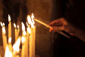 Lighting a candle in prayer