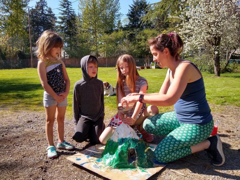 The kids made a papier-mâché volcano, painted it to look like Mt. Hood