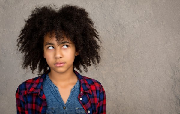 Young Teenage Girl With Afro Hair Thinking