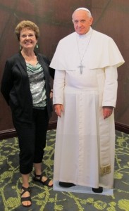 Barbara Falconer Newhall stands with a cardboard image of Pope Francis. Photo by RNA