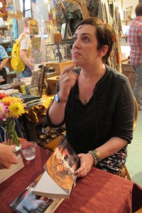 Catholic memoirist and author Kaya Oakes signs copies of her book Radical Reinvention at the Sagrada bookstore in Oakland, CA. Photo by Barbara Newhall