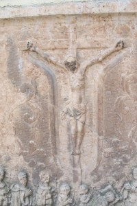 This stone Jesus crucified is embedded in the wall of the parish church in Melk, Austria. Photo by Barbara Newhall