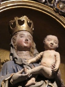 A statue of the Virgin Mary with infant Jesus stands in Annunciation Altar of the Regensburg Cathedral.  photo by Barbara Newhall