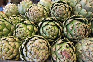 Artichokes stacked in a Whole Foods produce department. Photo by Barbara  Newhall