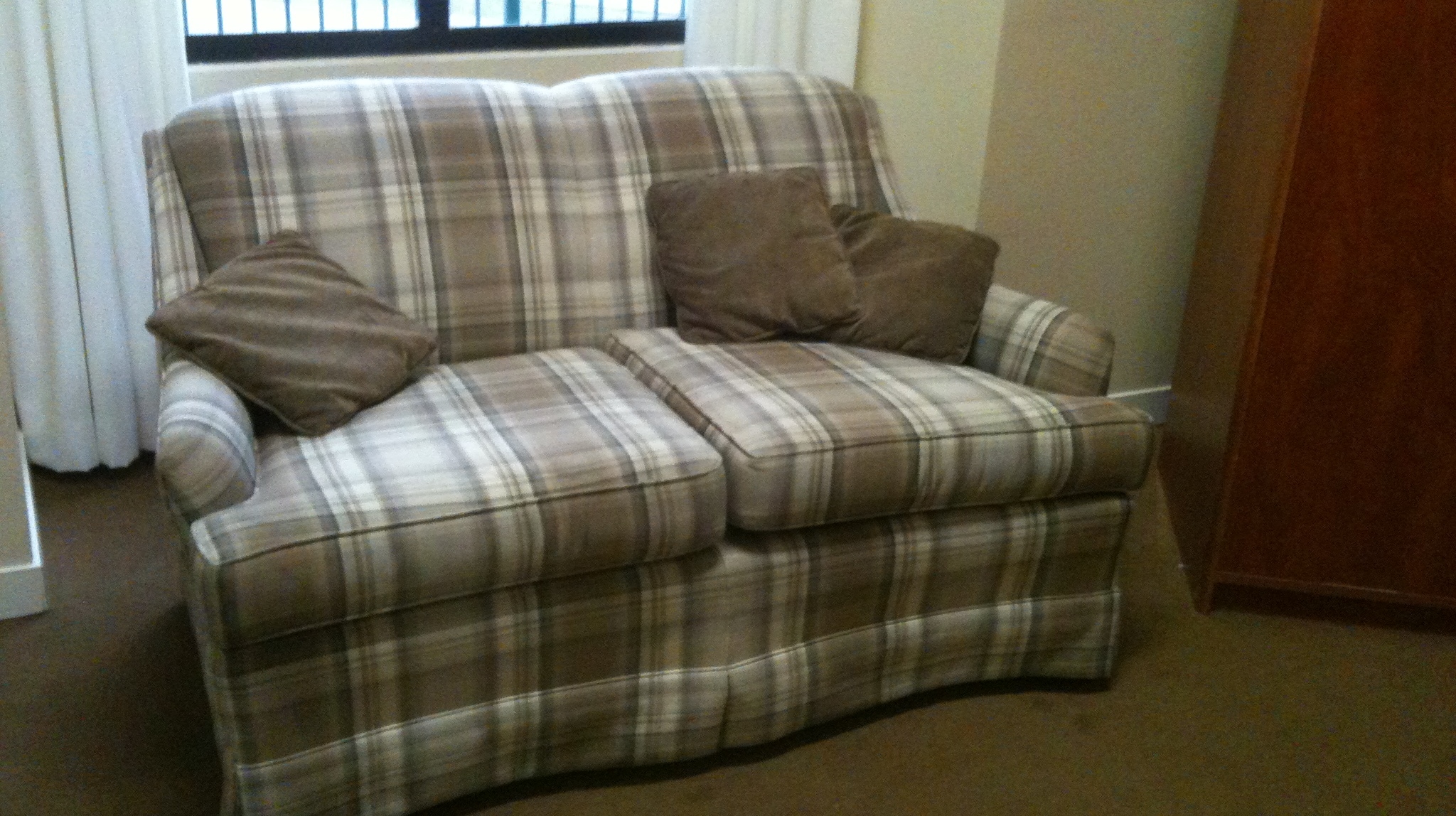 A plaid love seat owned by Barbara Falconer Newhall's mother. My Mother's Stuff. Photo by Barbara Newhall