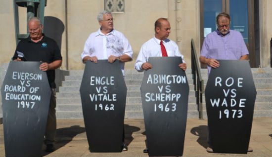 White evangelical preachers explain the partisan essence of their faith at an "Operation Save America" rally this summer in Wichita. (Photo via Right Wing Watch, click through for full article.)