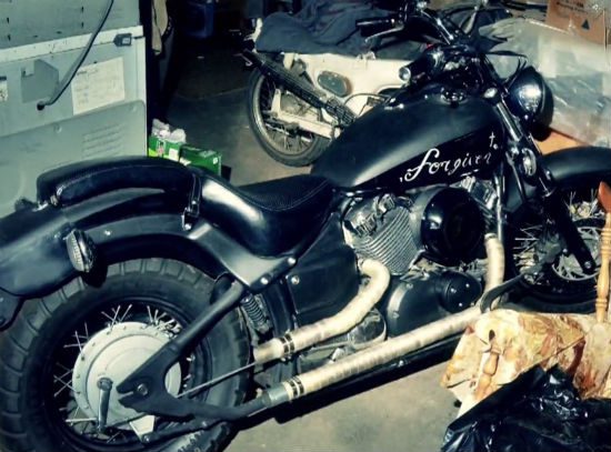 Note the cross and the "Forgiven" logo on the killer's motorcycle.