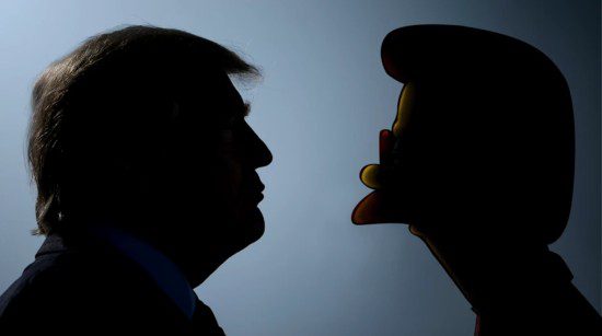 A backlit silhouette of Donald Trump faces a backlit silhouette of Ned Flanders. 