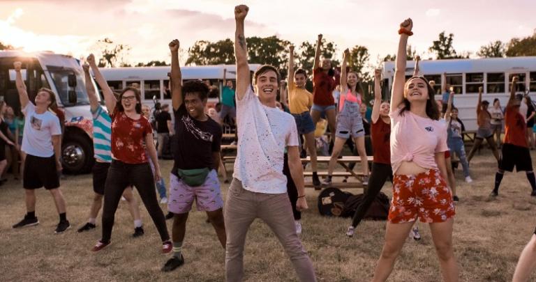 Teens dance at a summer camp.