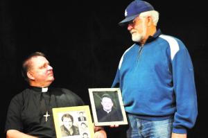 Father Stuart Long looks up at his father, Bill Long,