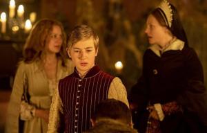 Three teens in Elizabethan garb.