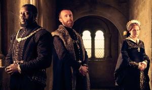 Three people in Elizabethan garb.