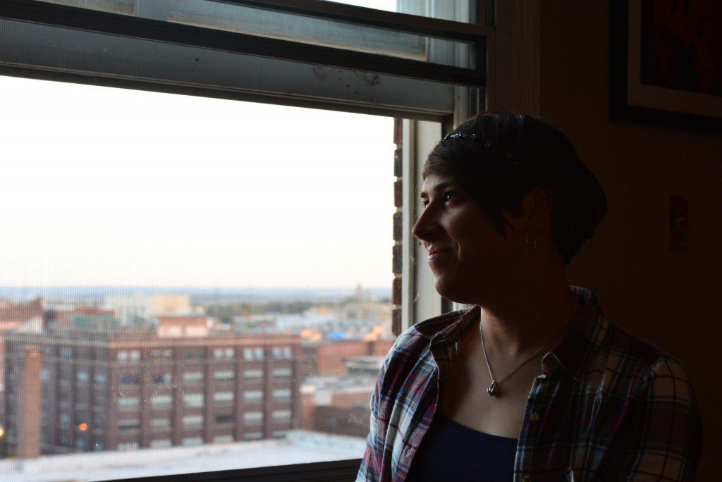 Staff Sgt. Ashleigh Buch, an instructor with the 338th Combat Training Squadron at Offutt Air Force Base, Neb., looks out over the city of Omaha from her apartment Oct. 20, 2016. Buch is the first openly serving transgender Airman to be recommended for a return to flying duties. (U.S. Air Force photo/Senior Airman Rachel Hammes) ; http://www.offutt.af.mil/News/Features/Display/Article/998356/transgender-airman-flies-high-with-new-af-policy/