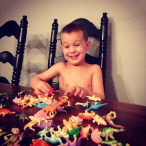 Jude  playing with his new dinosaur collection last Christmas. 