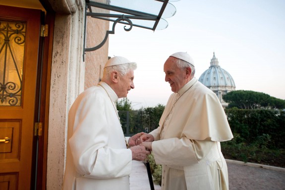 Retired Pope Benedict XVI greets Pope Francis at Mater Ecclesiae monastery at Vatican