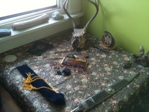 Skull, athame, wand, pentacle, chocolate... Tools for a ritual of some kind. 