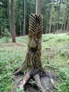 A carving in the forest. There were no signs indicating where it came from, who carved it, or what it meant. It was just there to be discovered while hiking. 