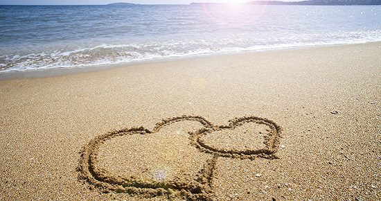 Hearts drawn on the sand of a beach
